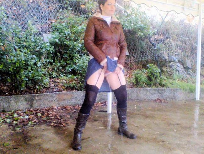 Thumbnail of Public pissing in a halter skirt and stocking in black boots