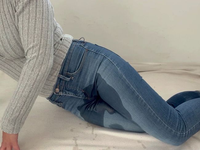 Stretched out on the floor in wet jeans