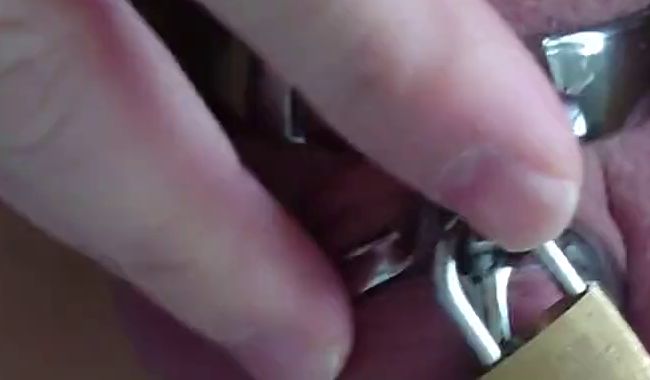 Piss in the penis cage with catheter in tights